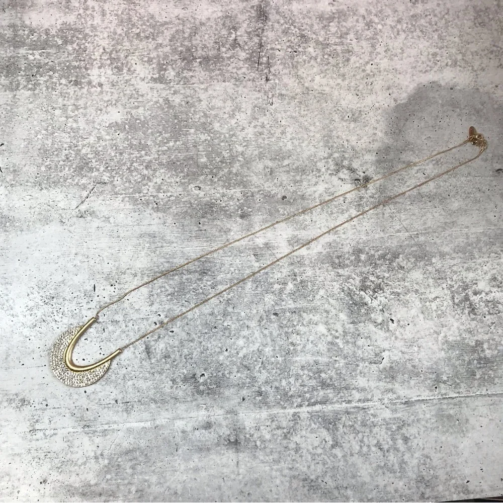 Plunder half moon long necklace.